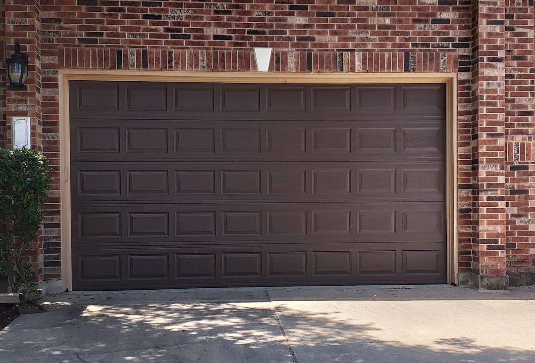 Newly installed 16 by 8 brown garage door